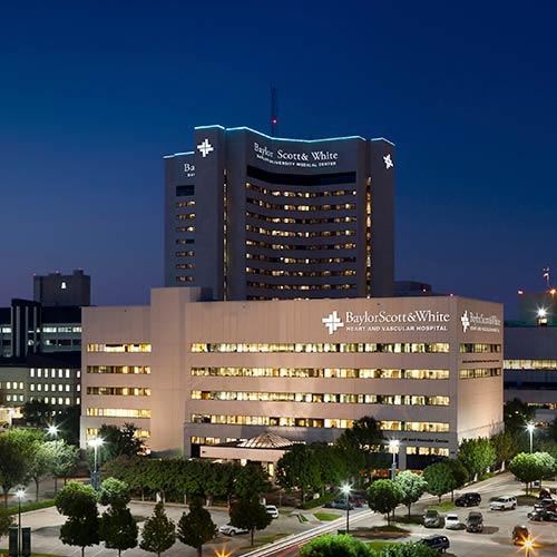 A night photo showing the Baylor Scott & White Heart and Vascular Hospital – Dallas building located on the medical campus of Baylor University Medical Center, part of Baylor Scott & White Health